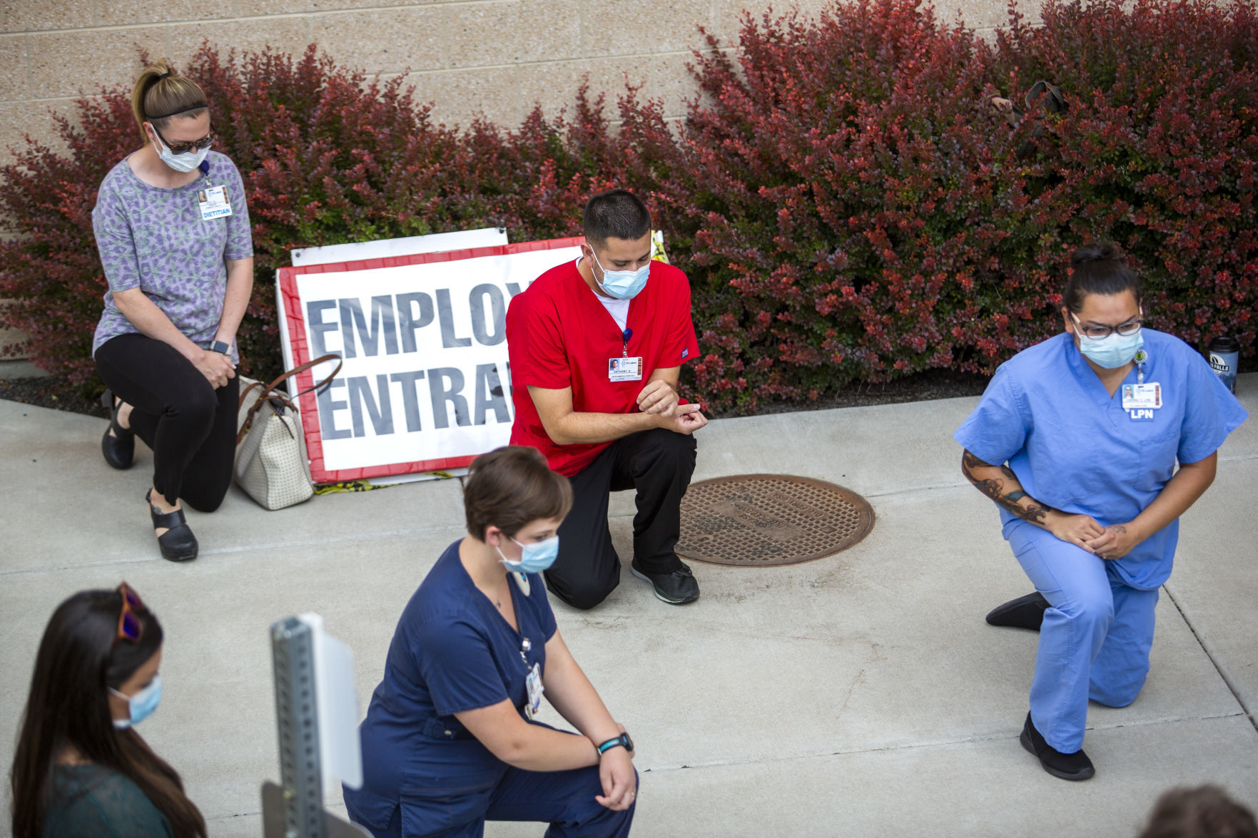 Hospital staff show solidarity with moment of silence